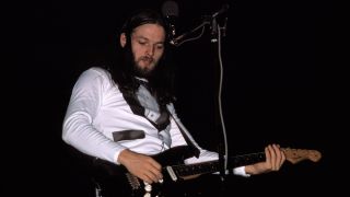 David Gilmour performing live onstage, playing black Fender Stratocaster, on Wish You Were Here tour