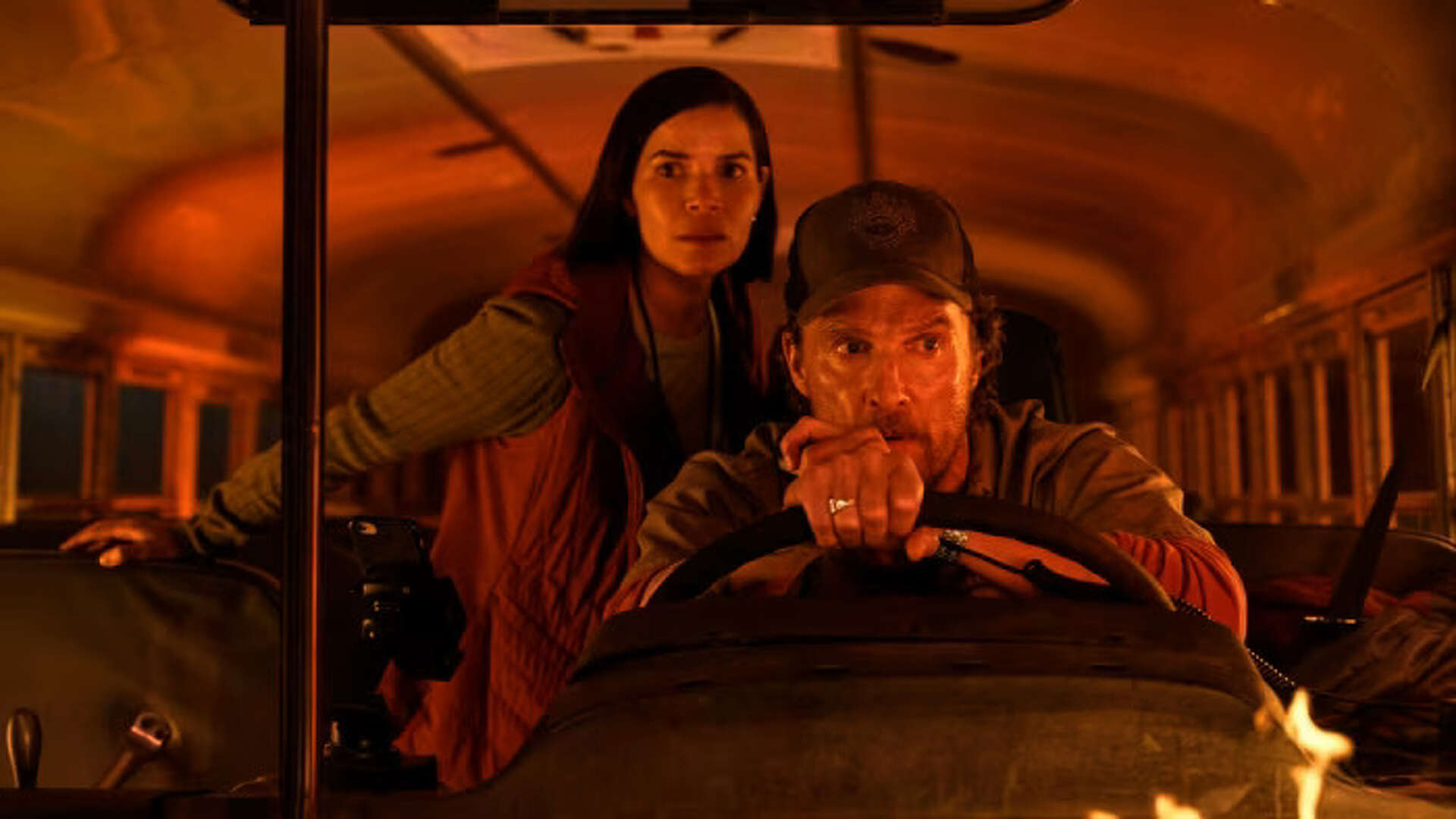 Mary and Levin on a school bus surrounded by fire in The Lost Bus