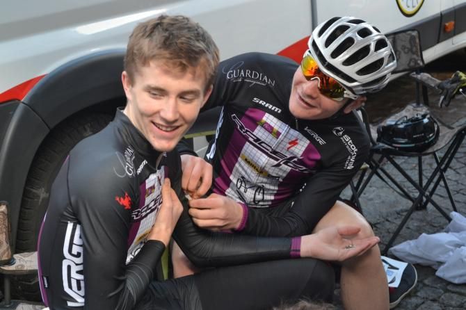 Peter Goguen lends a hand to Austin Vincent with his numbers.