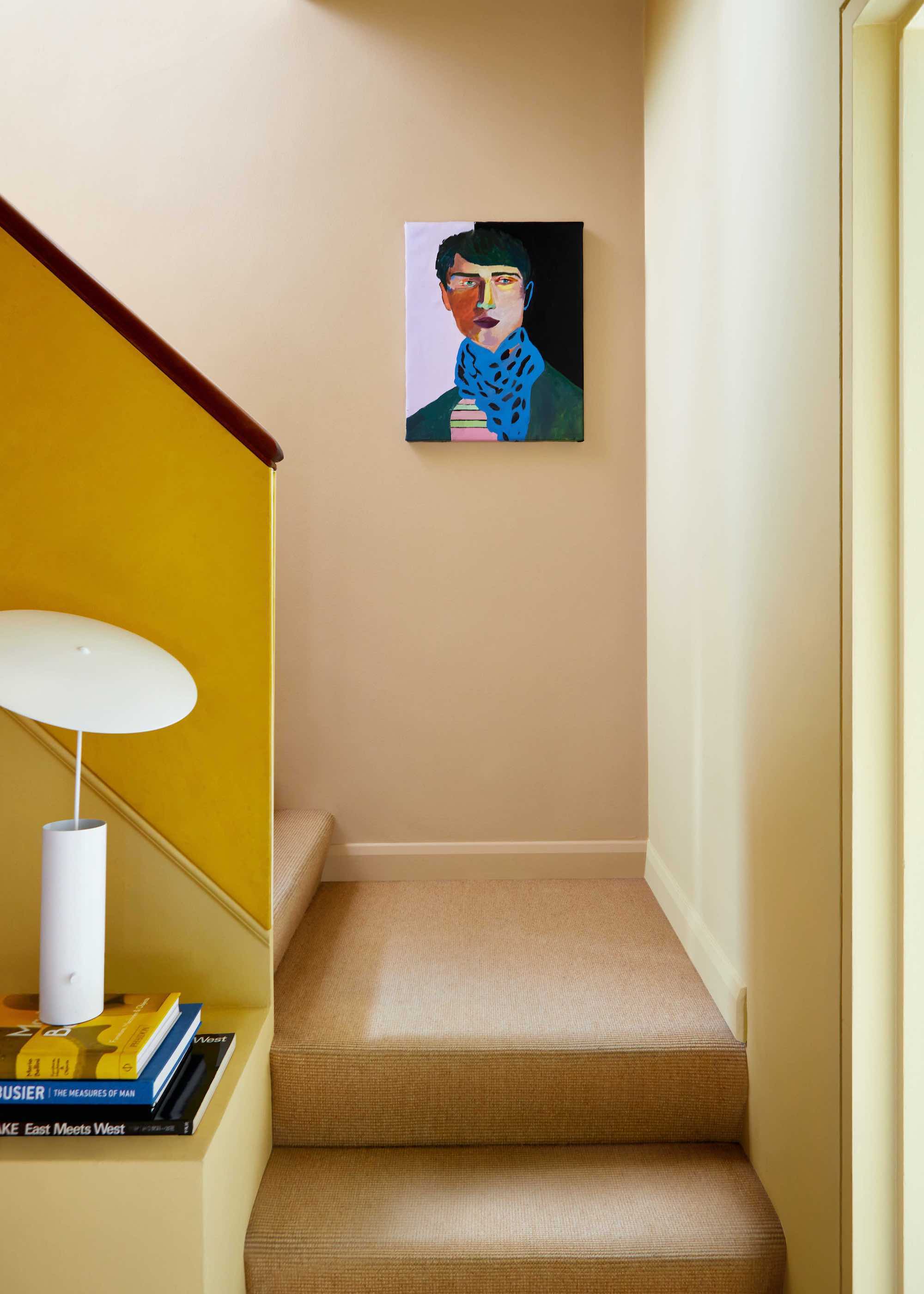 staircase with brown carpet and matching walls