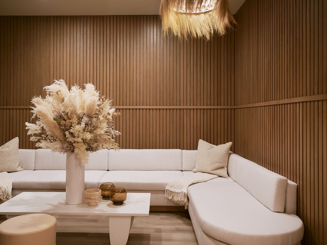A wooden-clad spa with contemporary creme furnishings in sculptural shapes.