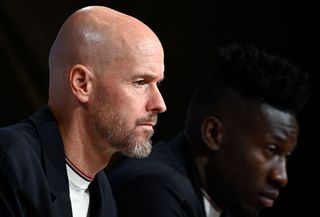 Manchester United manager Erik ten Hag (L) and Cameroonian goalkeeper #24 Andre Onana address a press conference on the eve of the UEFA Champions League Group A football match FC Bayern Munich v Manchester United in Munich, southern Germany on September 19, 2023.