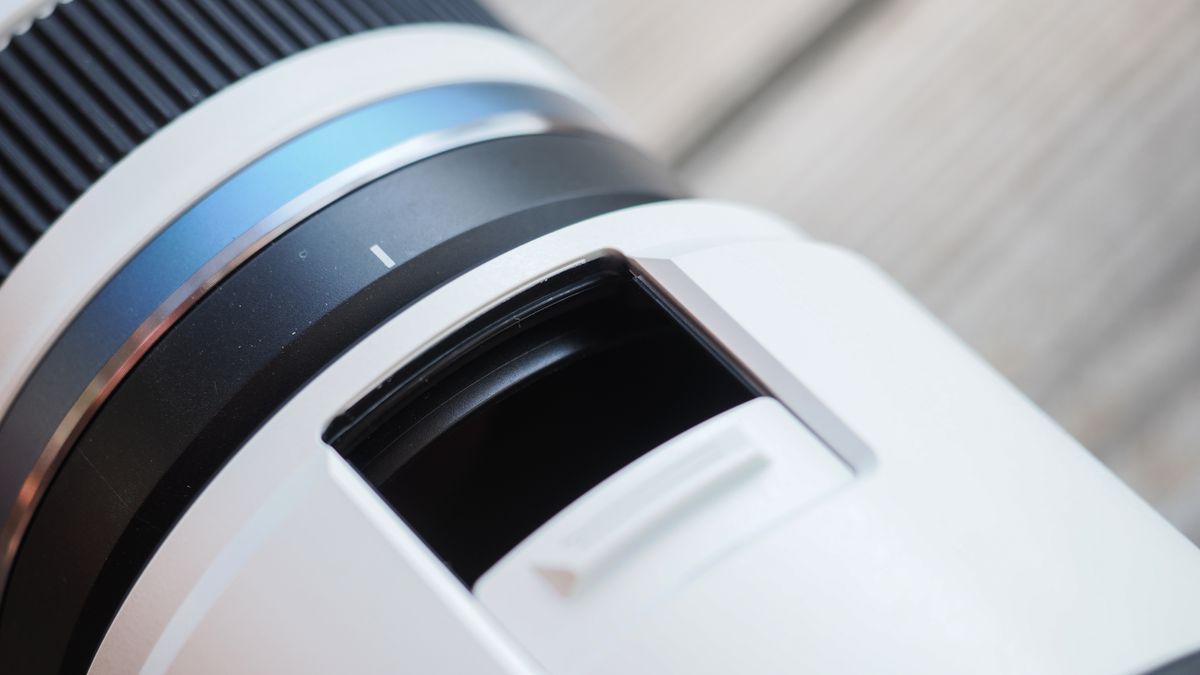 The OM System M.Zuiko 50-200mm f/2.8 IS Pro lens, mounted to the OM System OM-1 Mark II, in an outdoor setting