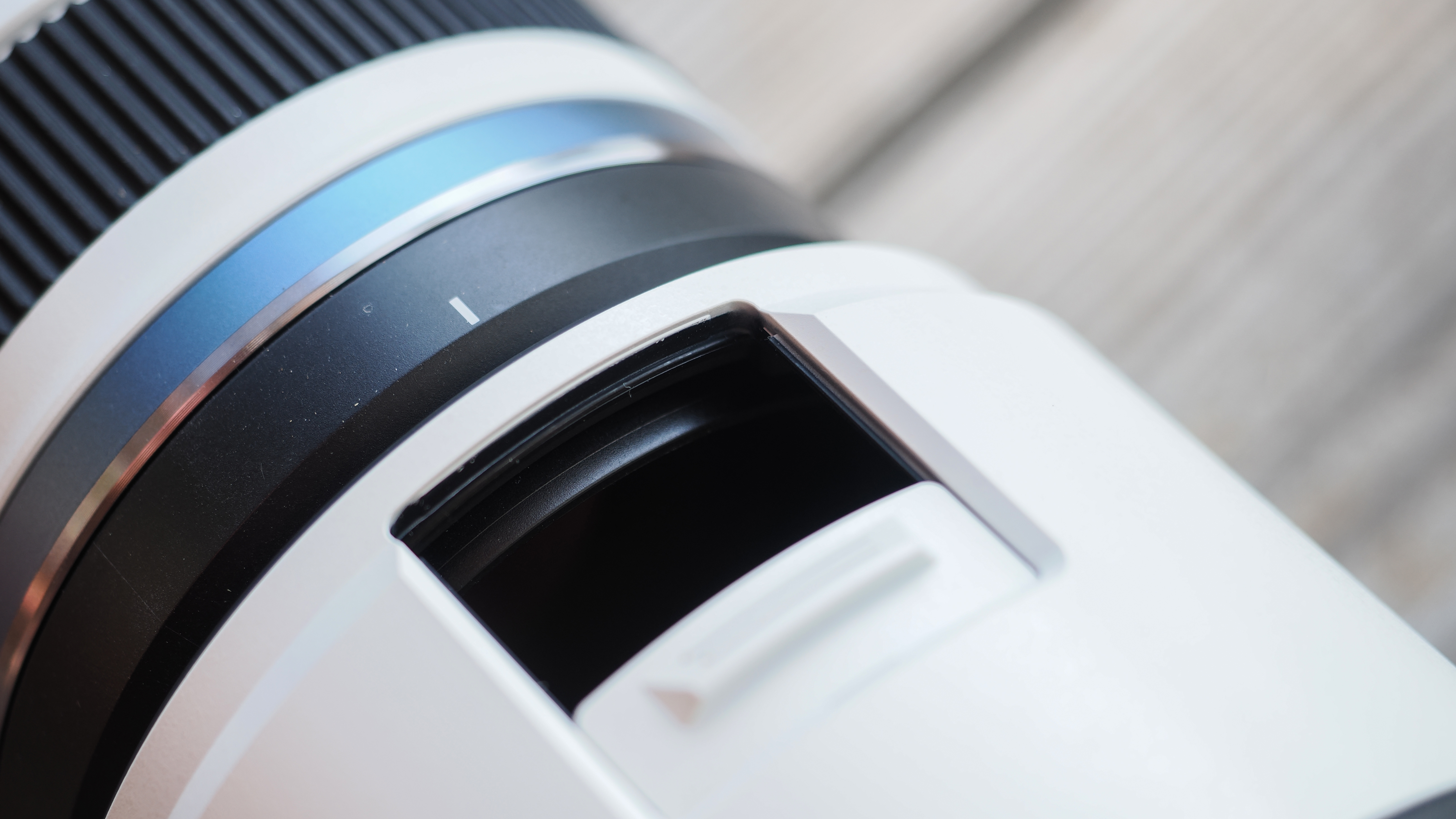 The OM System M.Zuiko 50-200mm f/2.8 IS Pro lens, mounted to the OM System OM-1 Mark II, in an outdoor setting