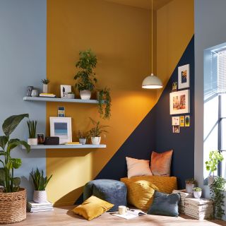 living room with wooden flooring and blue with yellow walls