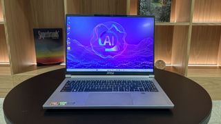 MSI Creator A16 AI+ open on table with open shelves in background