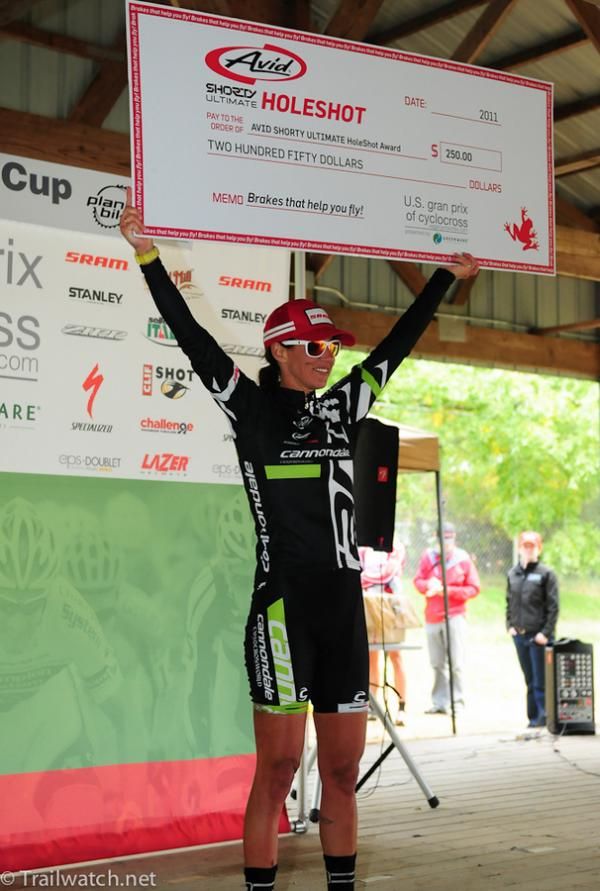 Nicole Duke (Cannondale) collects her check for winning the hole shot