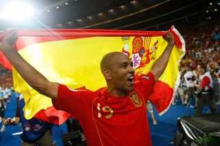 Marcos Senna of Spain celebrates, holding the Spanish flag, after Spain defeated Germany in the final of Euro 2008 at the Ernst-Happel Stadium in Vienna, Austria