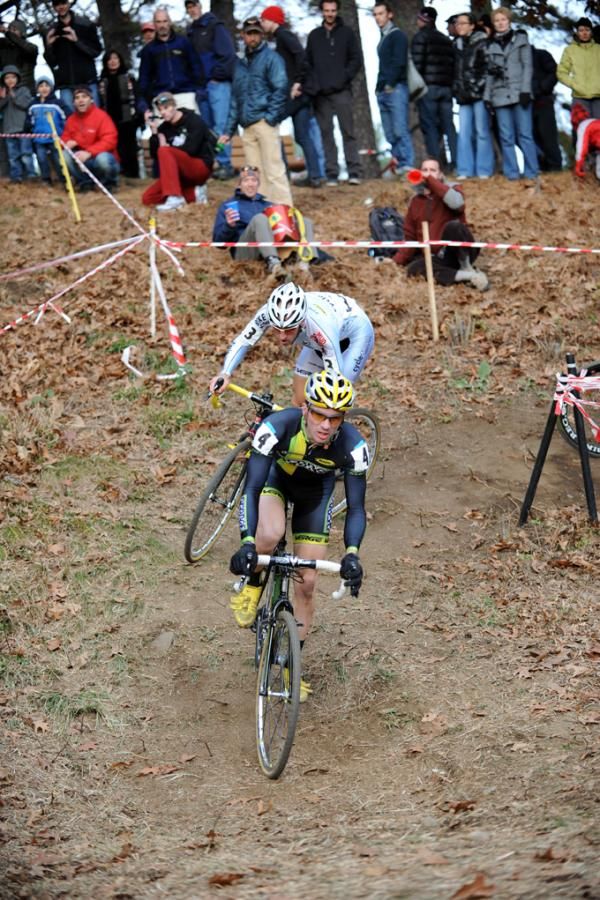 Dylan McNicholas (Pedro&rsquo;s) leads Adam Myerson (Cycle-Smart) through the off camber.