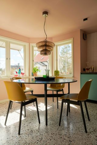Dining table and chairs inside Luca Nichetto Pink Villa