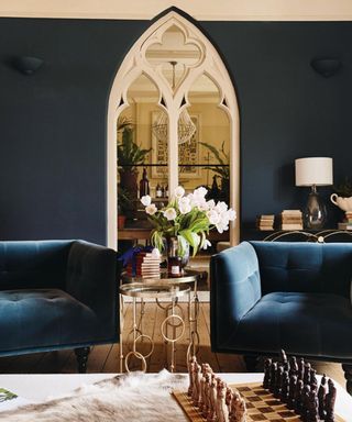 blue living room with velvet sofas