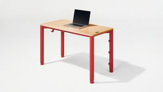 A bright red Herman Miller Spout table