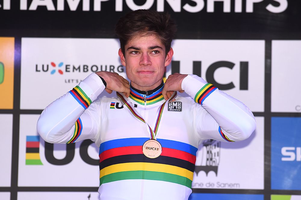 Wout Van Aert in the rainbow stripes.