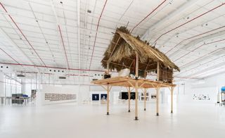 Hut on stilts in white interior: installation on show as part of Diriyah Contemporary Art Biennale 2024