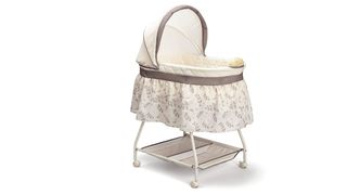 standalone bassinet bedside crib in patterned fabric