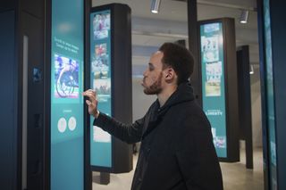 At New York’s Statue of Liberty Museum, a visitor participates in Becoming Liberty at one of 20 kiosks by choosing seven images that represent “liberty” to them.