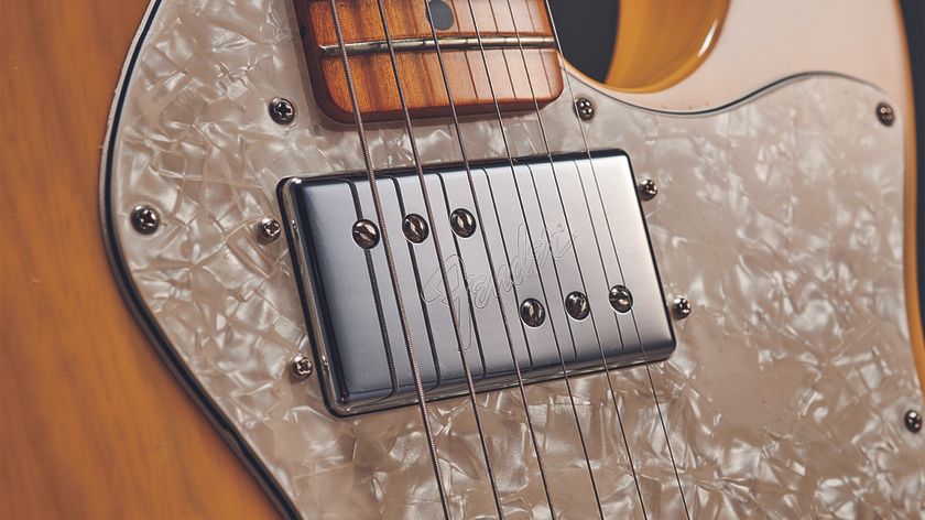 A detail photo of a Seth Lover–designed Wide Range Humbucker on a blond Telecaster Thinline electric guitar