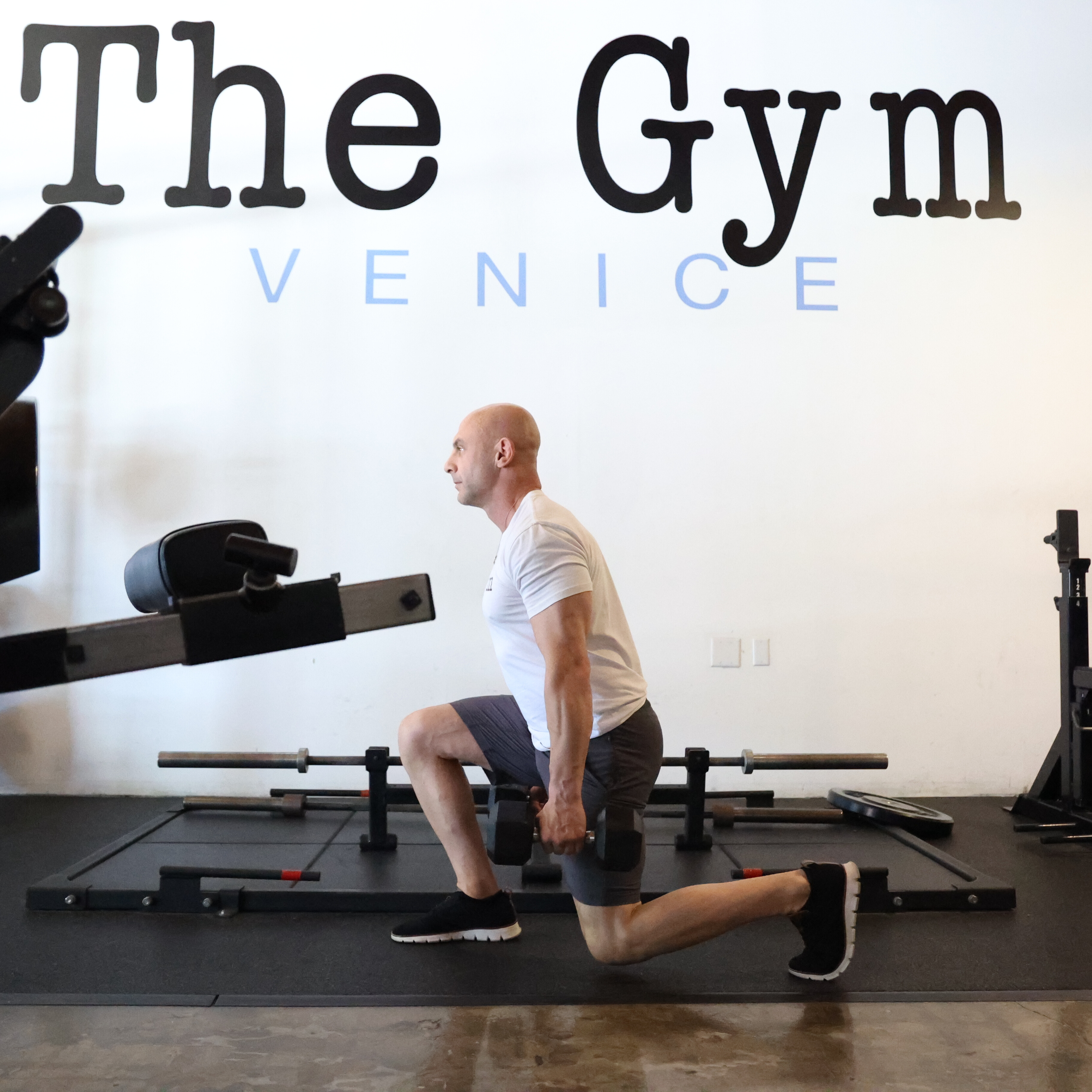 Man exercising in gym with kettlebell