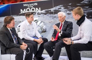 Apollo 17 commander Gene Cernan, the "last man on the moon," talks with members of the PTScientists moon mission team.