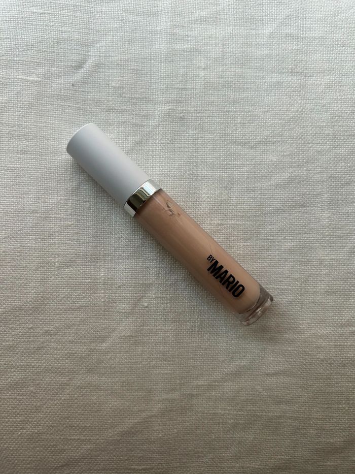 The Makeup By Mario Surrealskin&amp;trade; Awakening Concealer on a white linen background