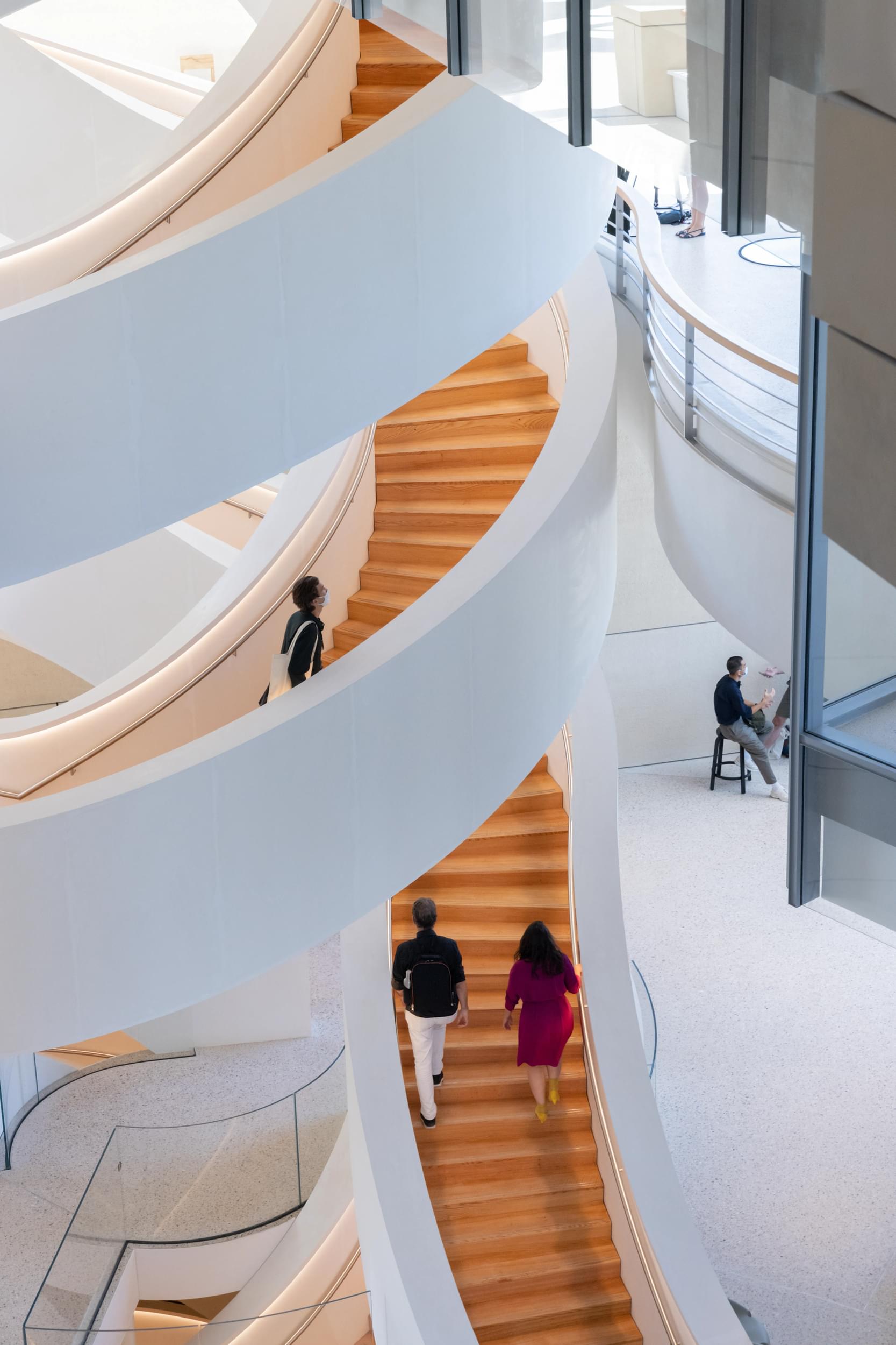 A futuristic museum with white, intersecting staircases.