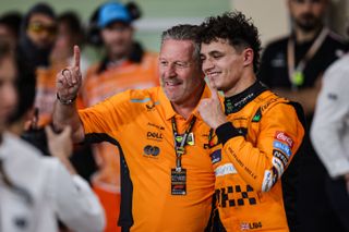 Zak Brown, CEO of McLaren Racing, and Lando Norris of the McLaren F1 Team celebrate the Constructors' World Championship