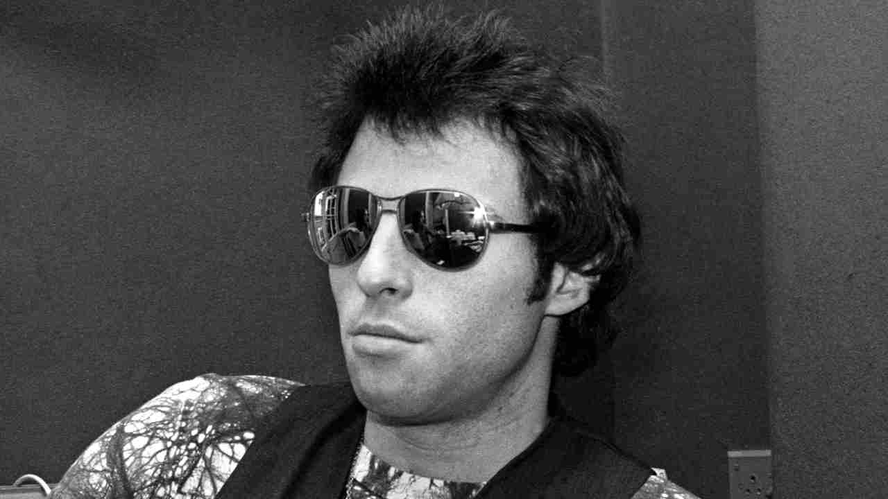 Nils Lofgren posing for a photograph in the 1970s