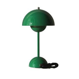 A table lamp in dark green