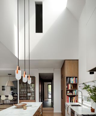 kitchen with high ceiling and skylight