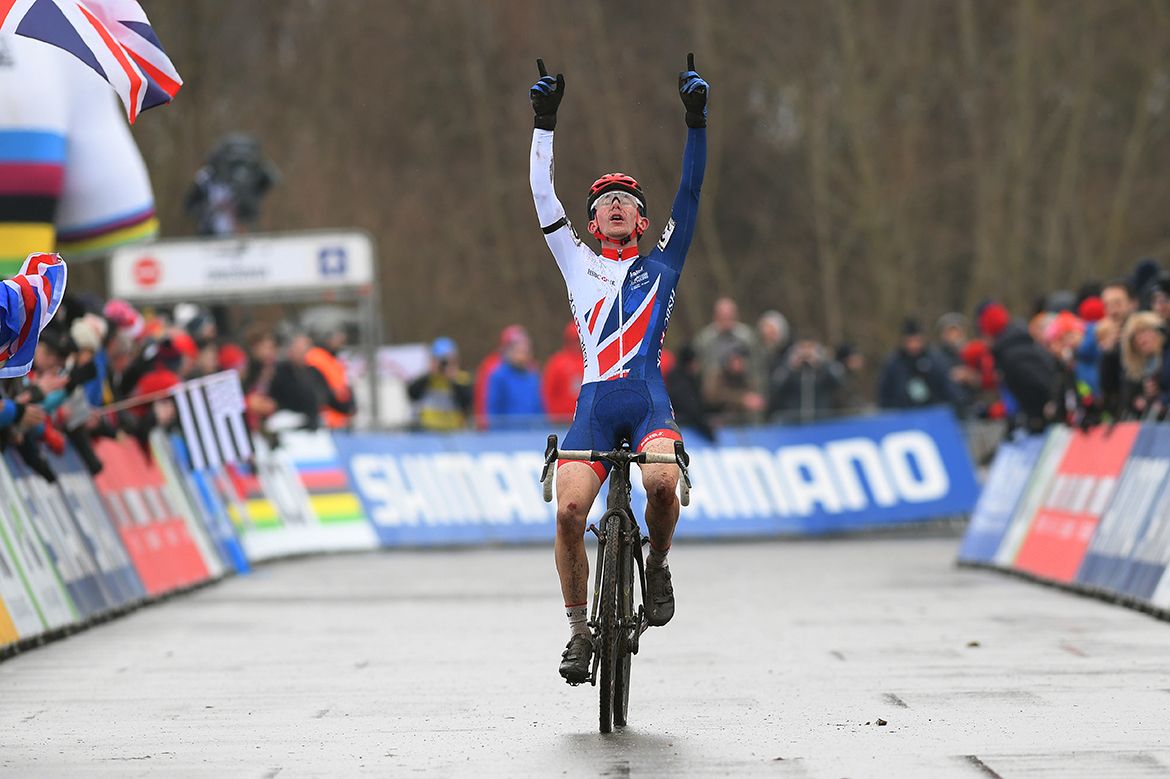 Dan Tulett celebrates his victory, pointing to the sky in honour of Charlie Craig