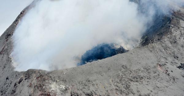 The black lava dome inside the crater.