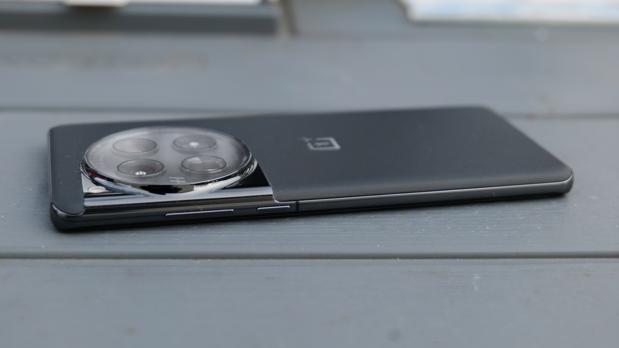 OnePlus 12 held in the hand.