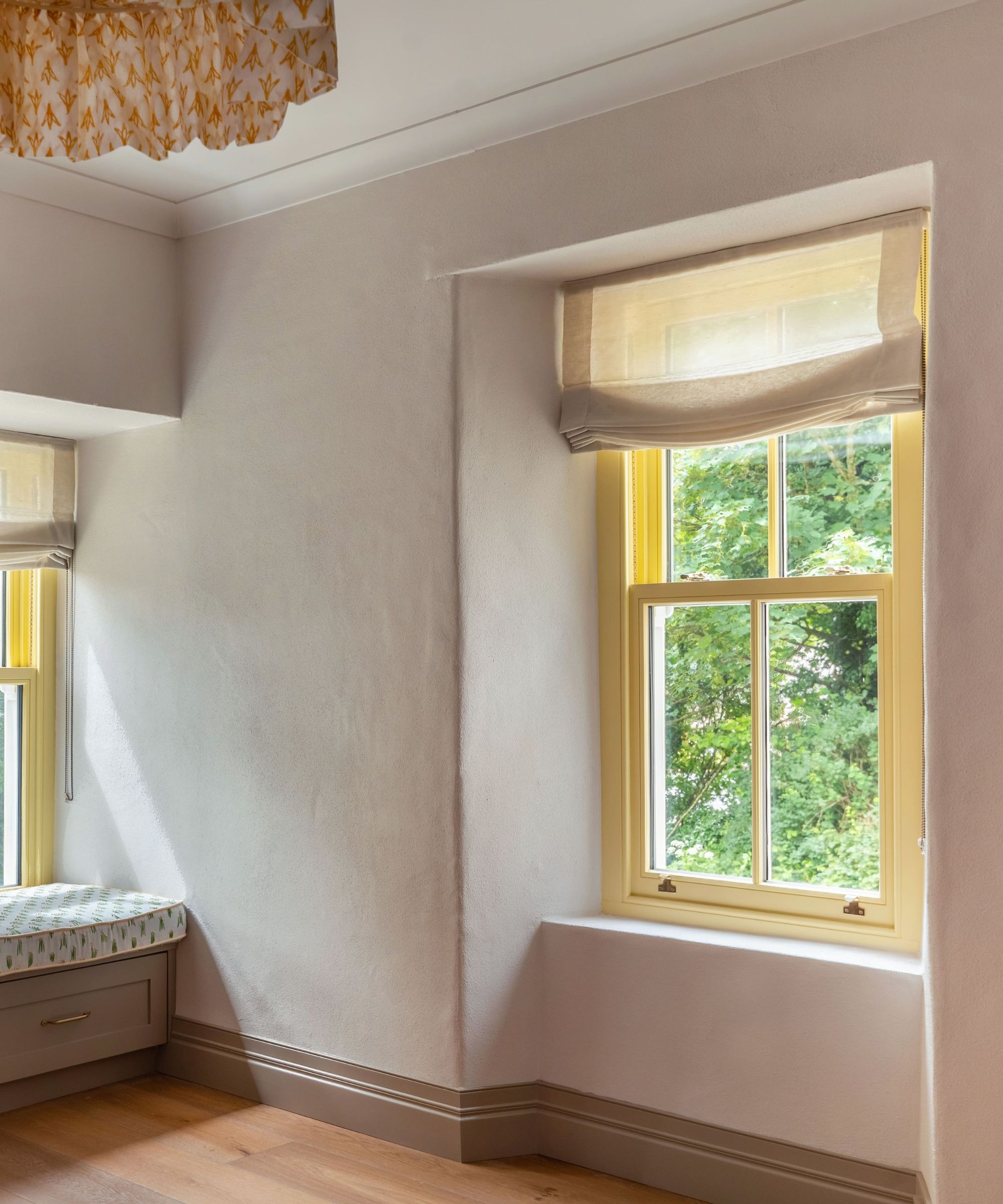 Cream room with yellow window frames