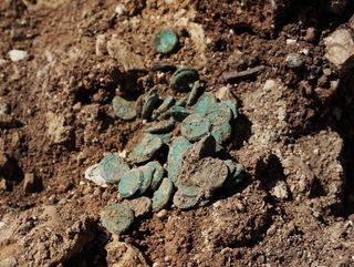 A hoard of 2,000-year-old bronze coins was discovered in a house that was part of an ancient Jewish settlement during the Great Revolt against the Romans.