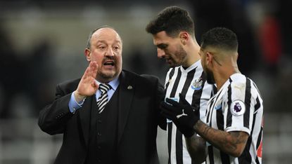 Newcastle manager Rafael Benitez speaks with Fabian Schar and DeAndre Yedlin during the win against Manchester City
