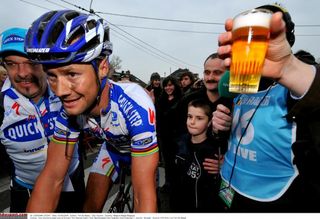 Fans offer Boonen a beer following the 2009 Kuurne-Brussel-Kuurne