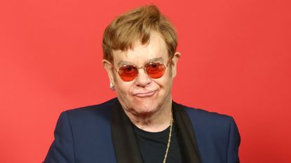 elton john on a red background