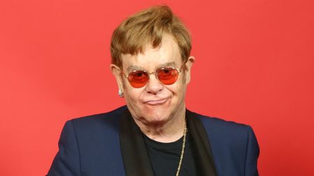 elton john on a red background