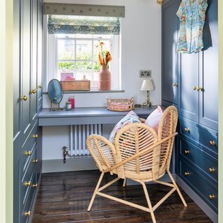 green bedroom with dressing room and wardrobes