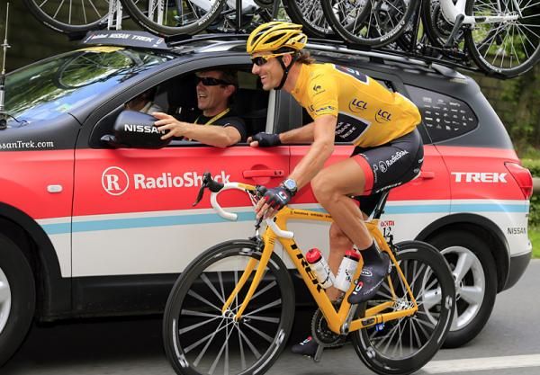 Fabian Cancellara (RadioShack-Nissan) has a word with his directeur sportif at the team car.