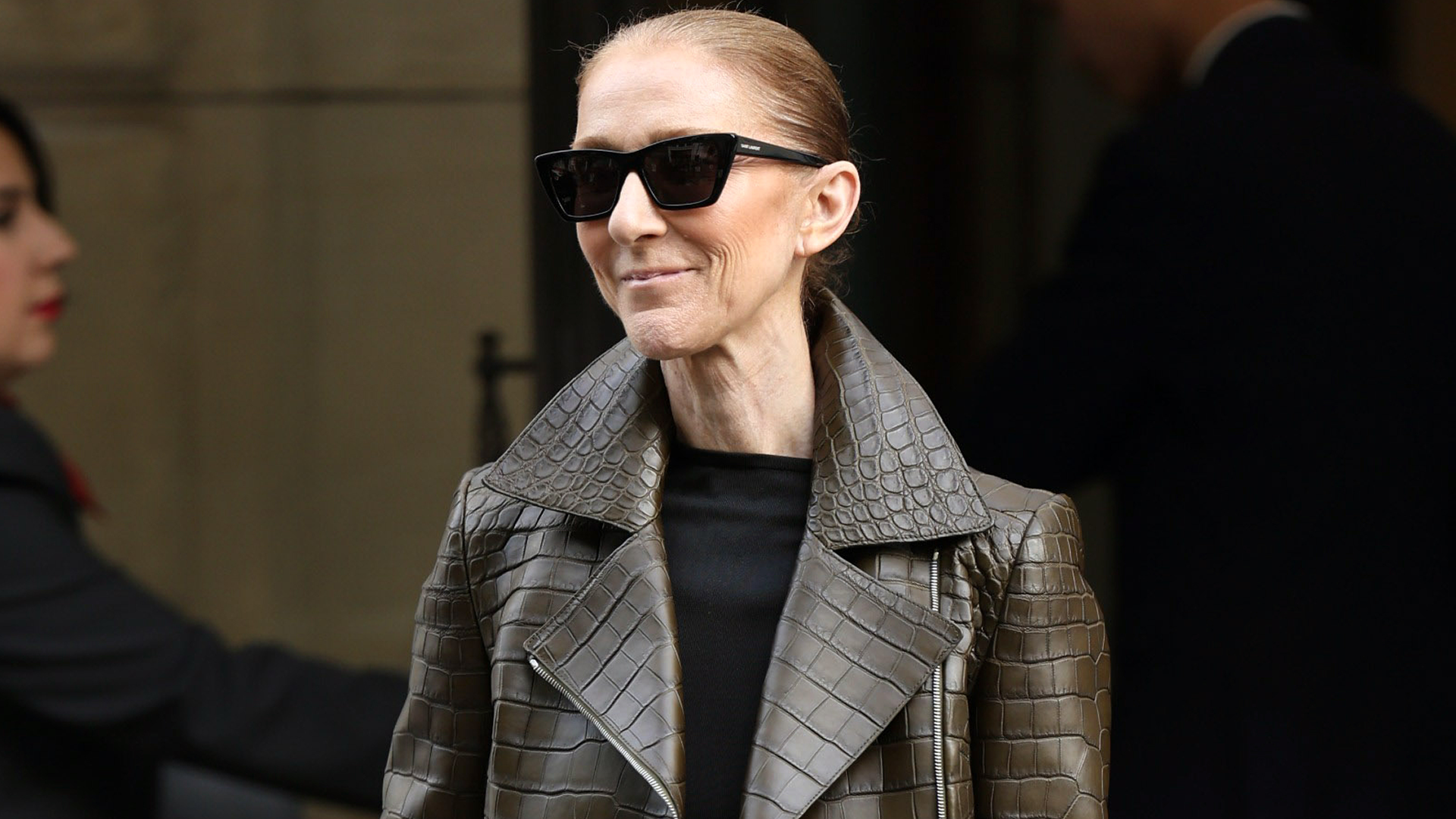 C&eacute;line Dion styled the Bermuda shorts trend for fall with a croc-embossed leather jacket and matching boots
