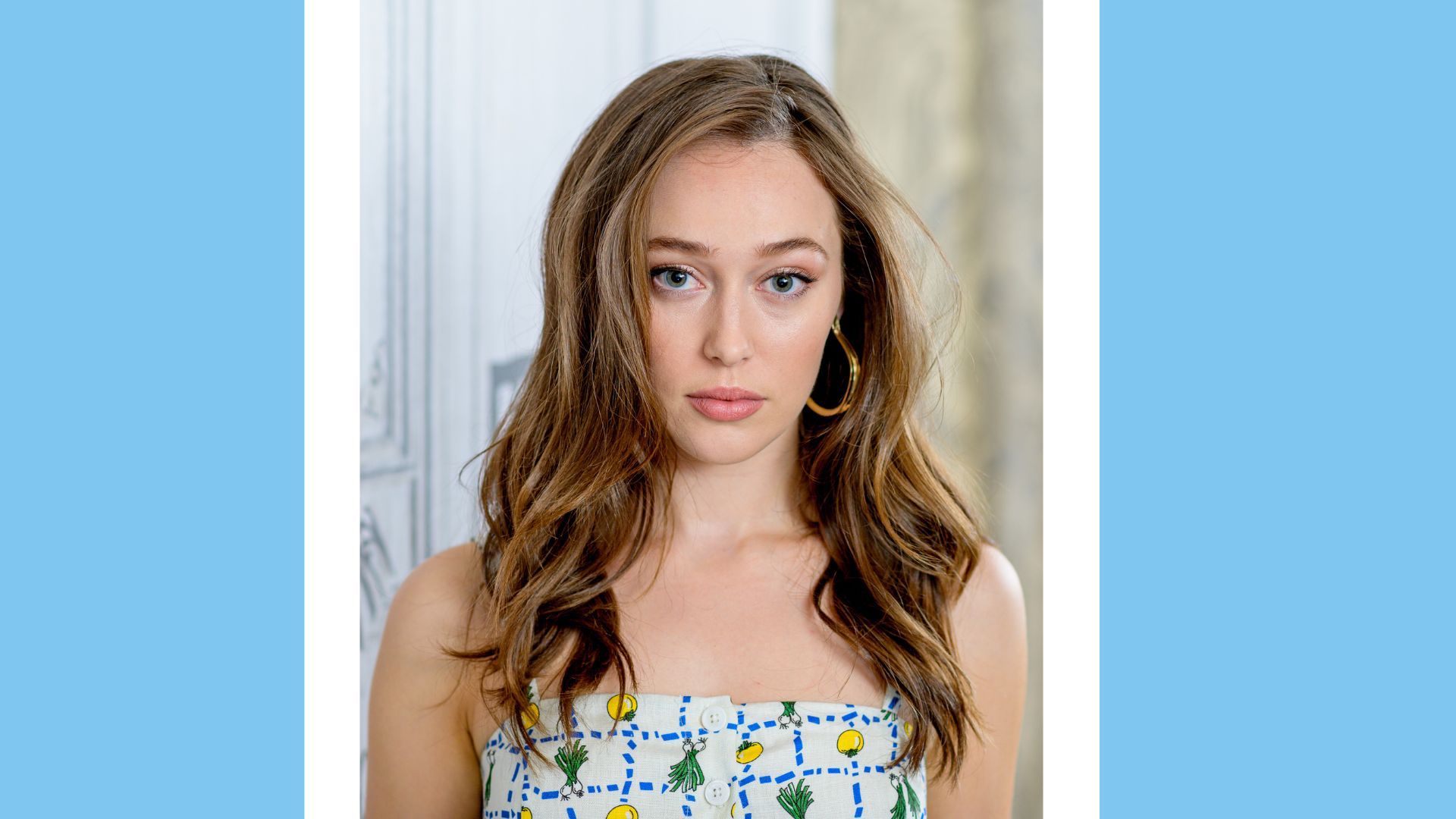 Alycia Debnam-<b>Carey</b> headshot on a blue background.