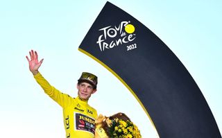 JumboVisma teams Danish rider Jonas Vingegaard celebrates on the podium with the overall leaders yellow jersey after winning the 109th edition of the Tour de France cycling race after the 21st and final 1156 km stage between La Defense Arena in Nanterre outside Paris and the ChampsElysees in Paris France on July 24 2022 Photo by Marco BERTORELLO AFP Photo by MARCO BERTORELLOAFP via Getty Images