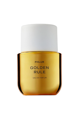 Phlur golden rule perfume in metallic gold bottle with large white cap on white background 