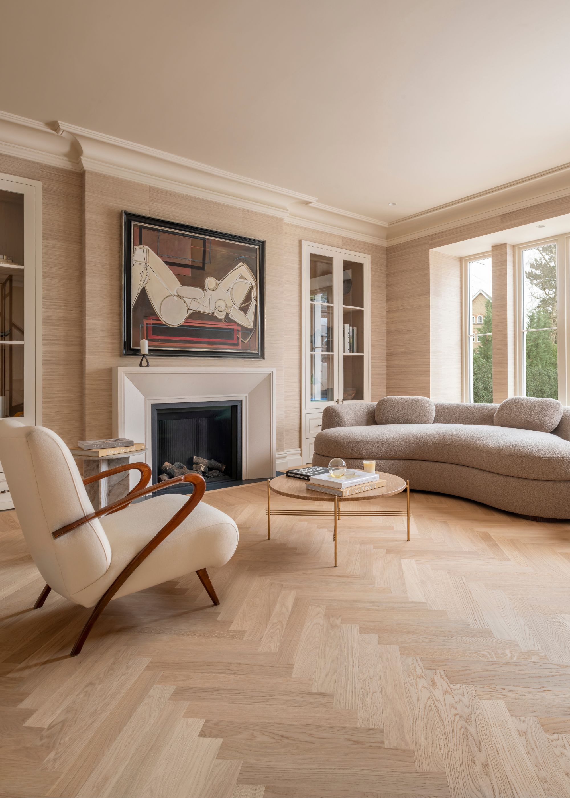 A living room with light, wood toned flooring