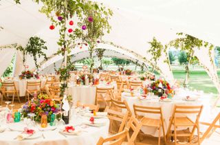 marquee filled with decorations for backyard wedding