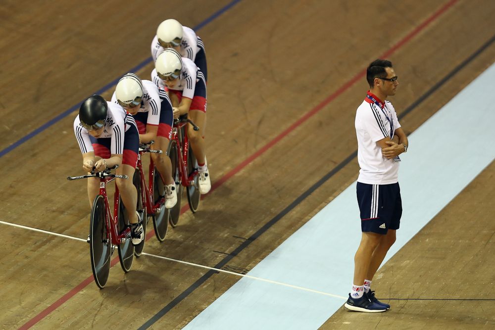 Chris Newton 'walks the line' for the GB women's pursuit team in the first round of the women's team pursuit on day one of the UCI Track Cycling World Cup