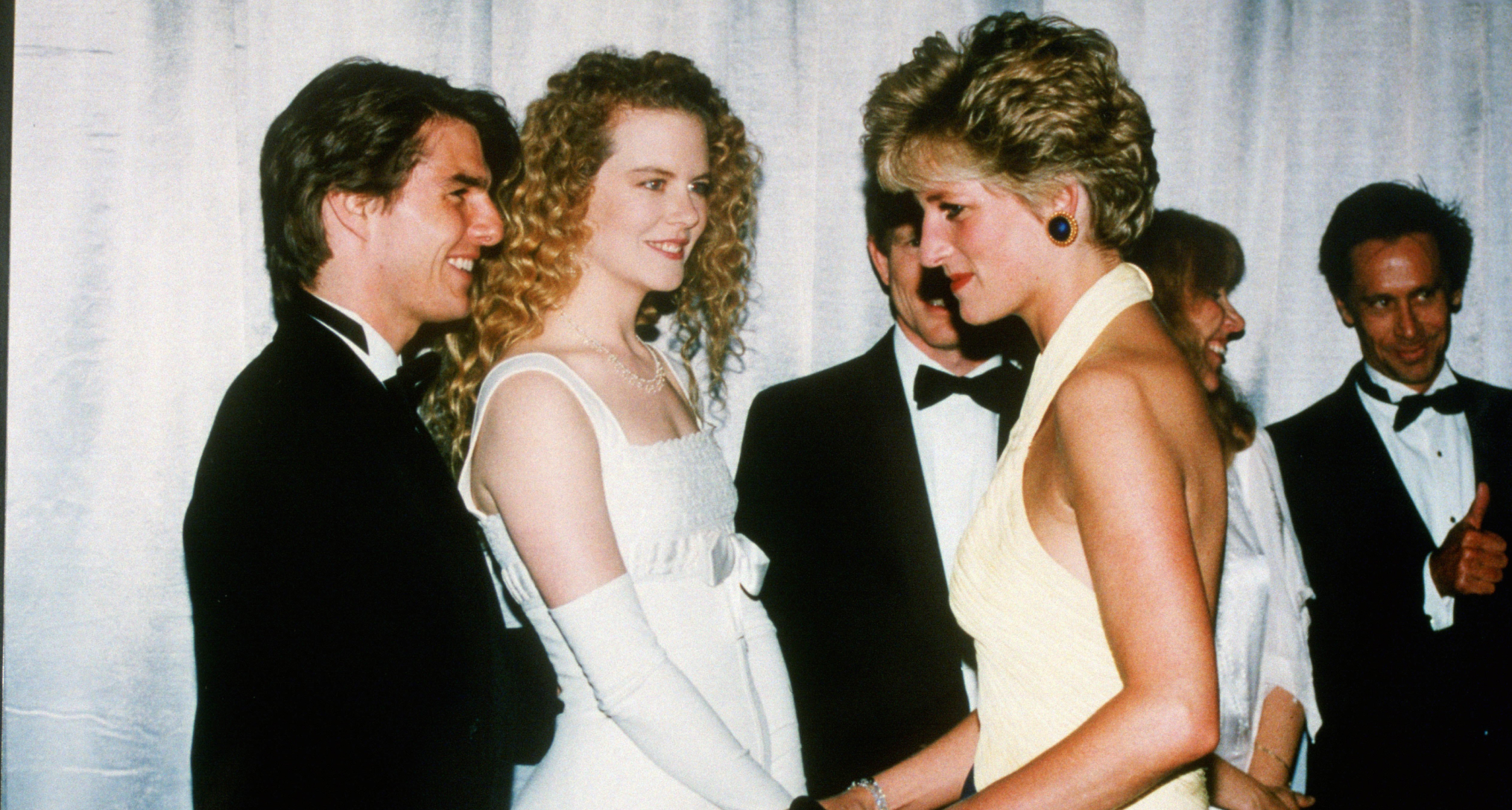 Princess Diana talking to Tom Cruise and Nicole Kidman at a movie premiere