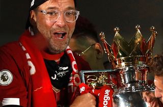 Jurgen Klopp, Liverpool manager, celebrating with the Premier League trophy