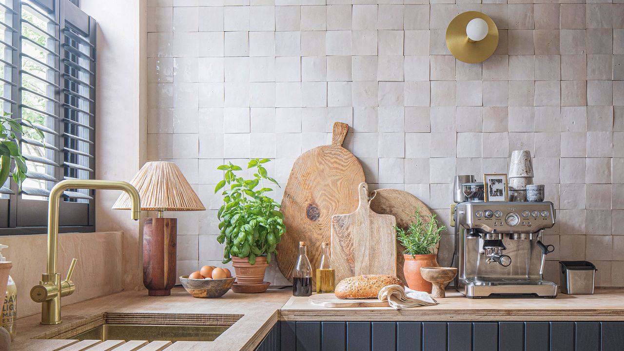 Beige tiled kitchen with wooden chopping boards